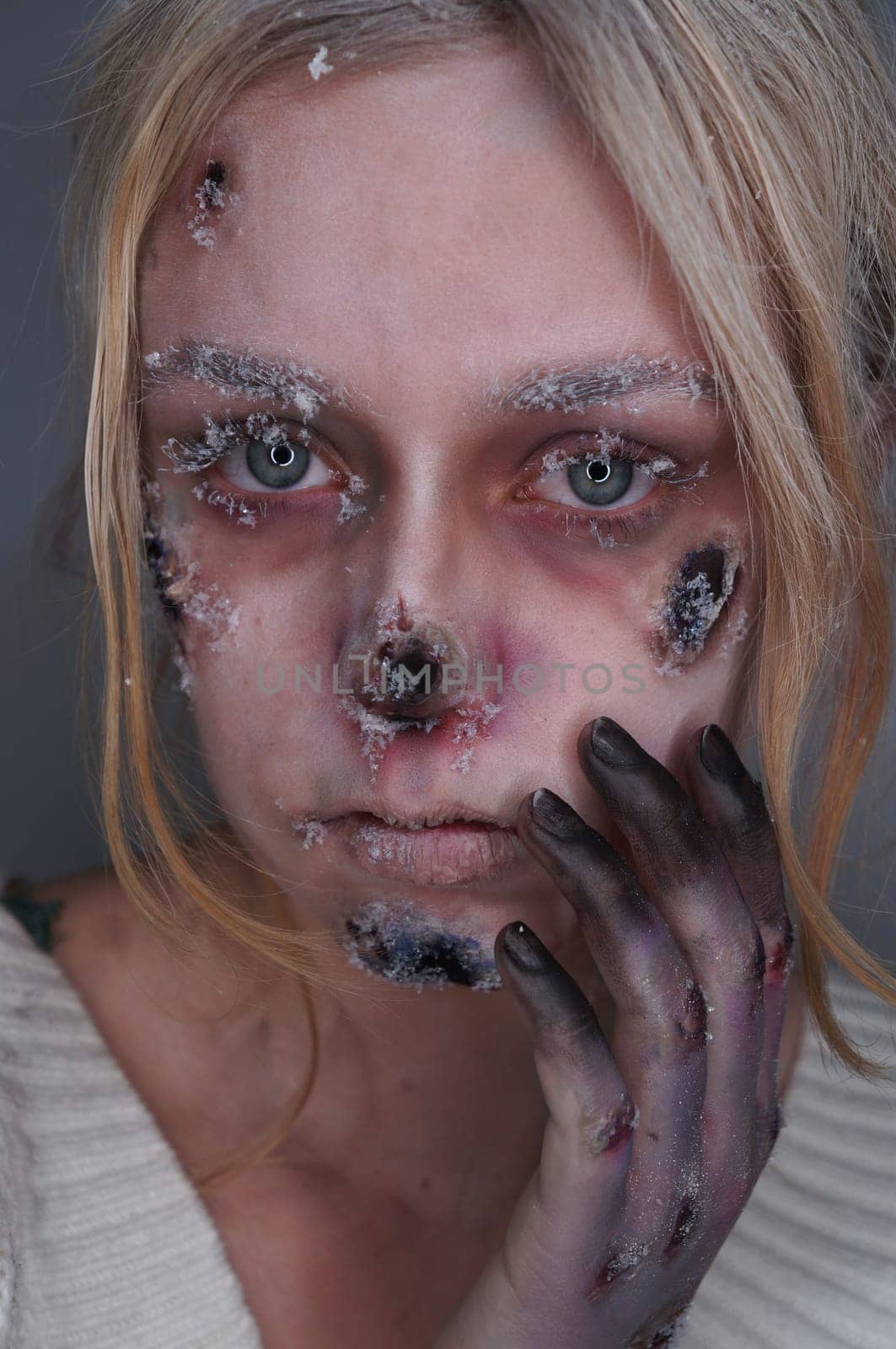 young blond woman with frostbite sfx makeup