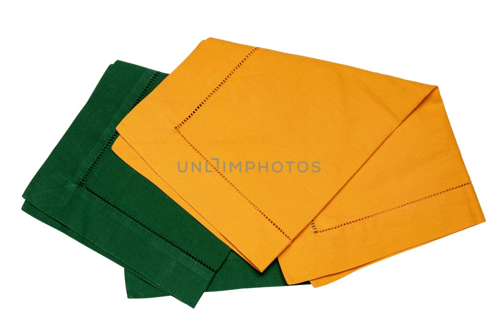 Closeup of a green and a yellow napkin or tablecloth isolated on white background. Kitchen accessories.