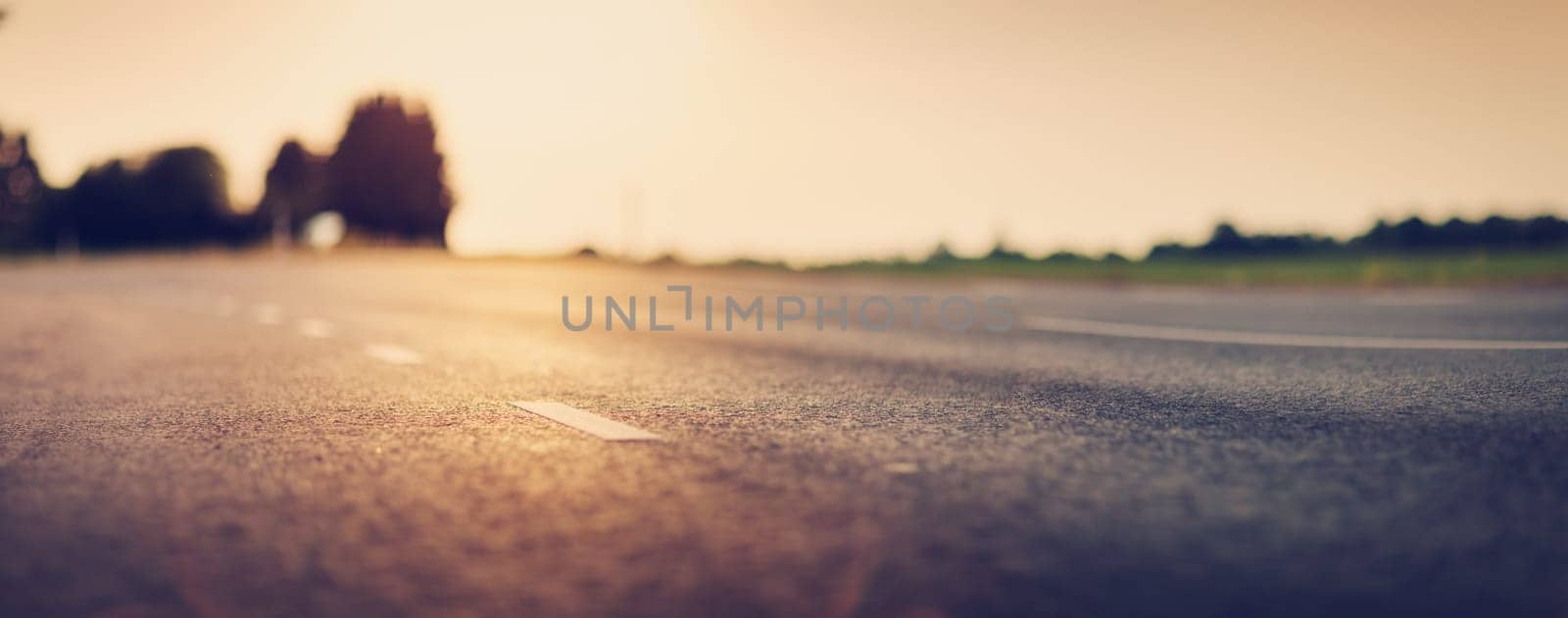 black asphalt road and white dividing lines