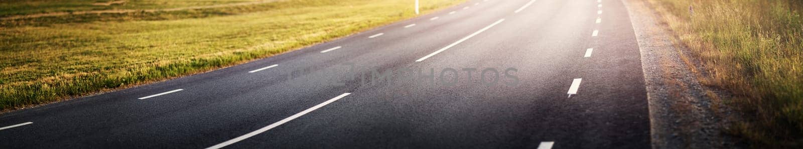 black asphalt road and white dividing lines