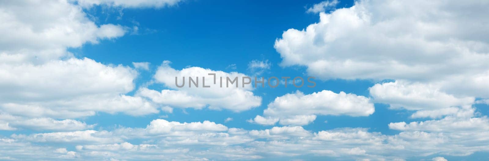 white clouds on the blue sky on sunny day
