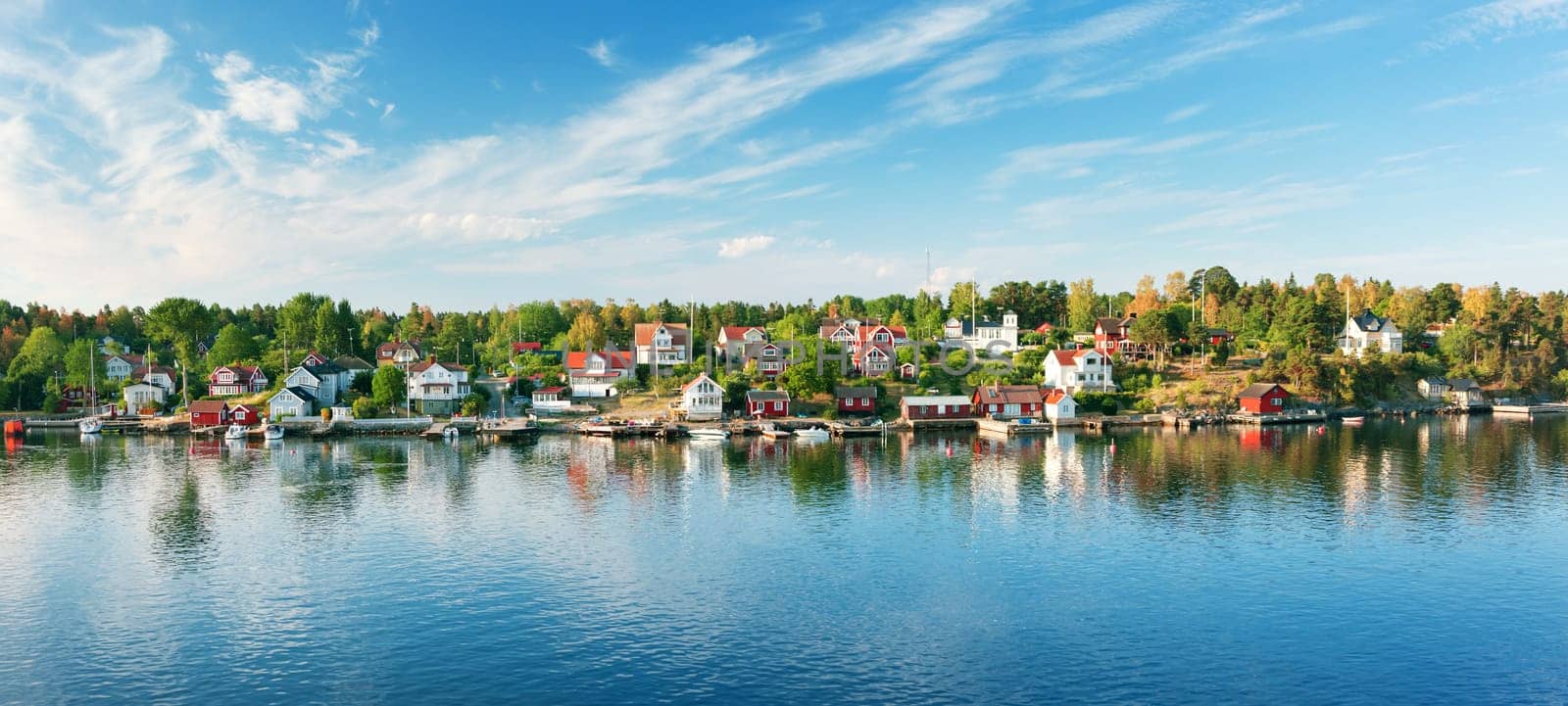 Small islands in the morning near to Stockholm. Swedish landscape with traditional red houses