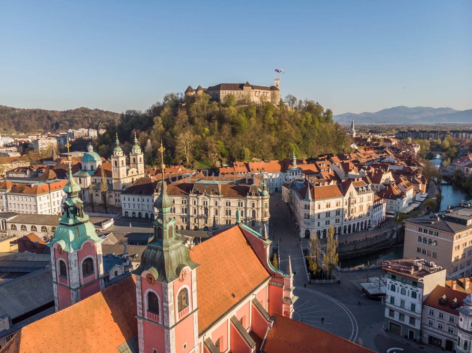 Aerial drone panoramic view of Ljubljana, capital of Slovenia in warm afternoon sun.
