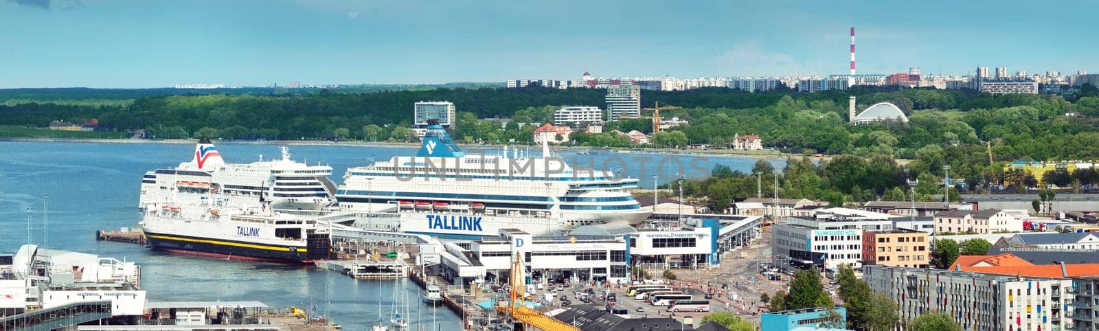 TALLINN, ESTONIA - JULY 10: View to the port in the center of Tallinn on JULY 10, 2016. View to the high buildings in the center of estonian capital. Harbour near Old Town.