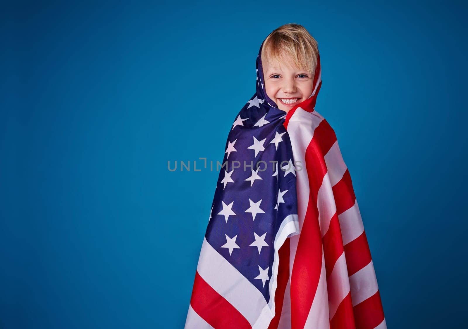 Little boy holding American flag