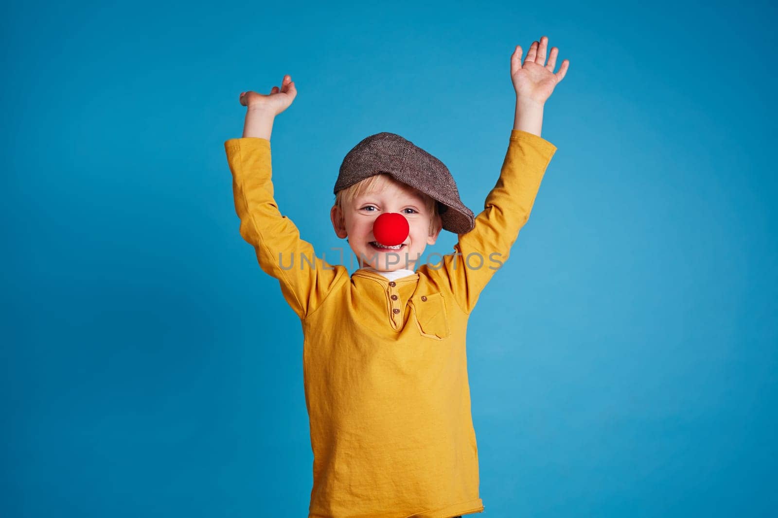 Portrait of a boy with clown nose