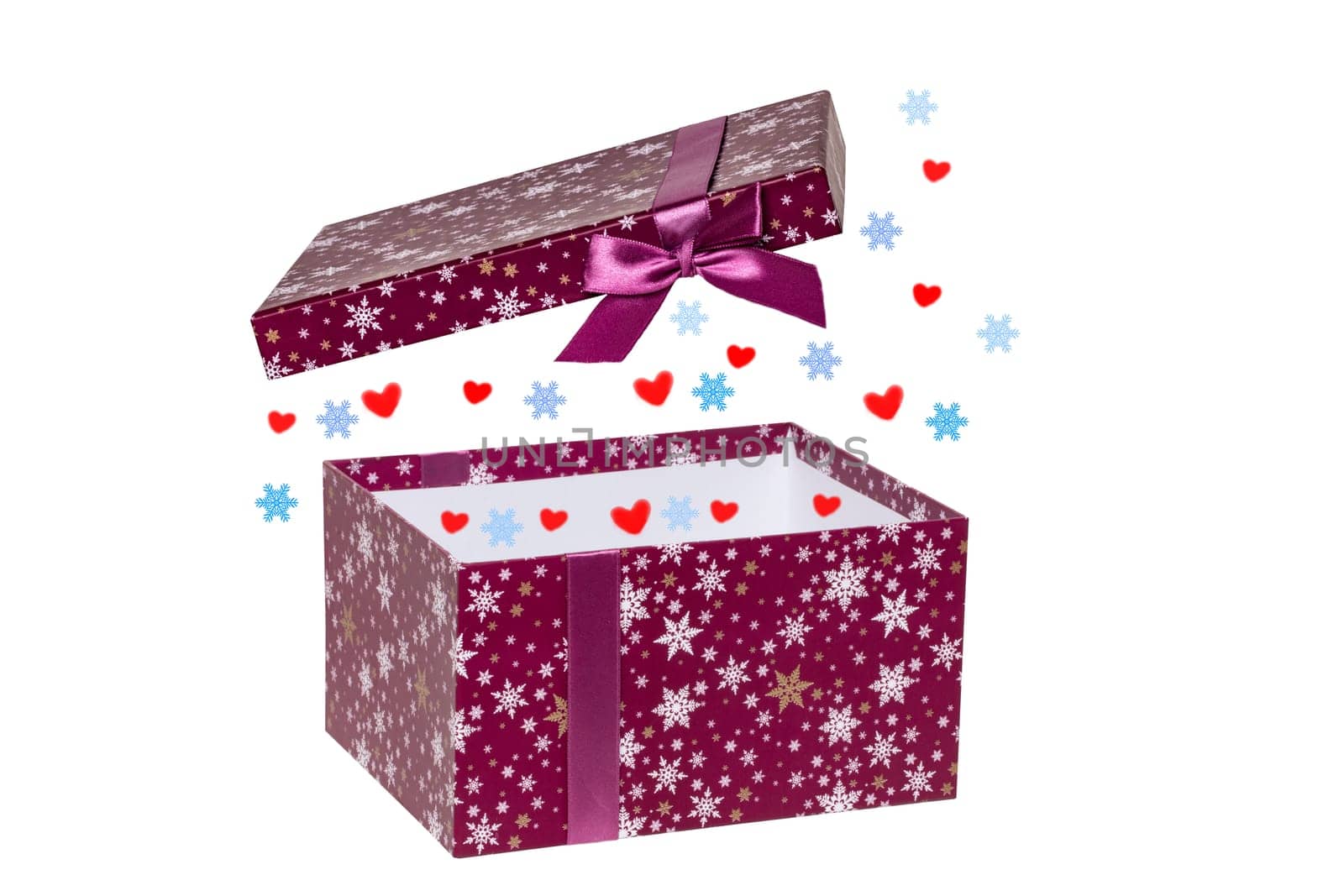 Gift box isolated. Close-up of a pink present or gift box with some hearts and stars isolated on a white background. Birthday, valentine, anniversary or other holidays. Macro photograph.