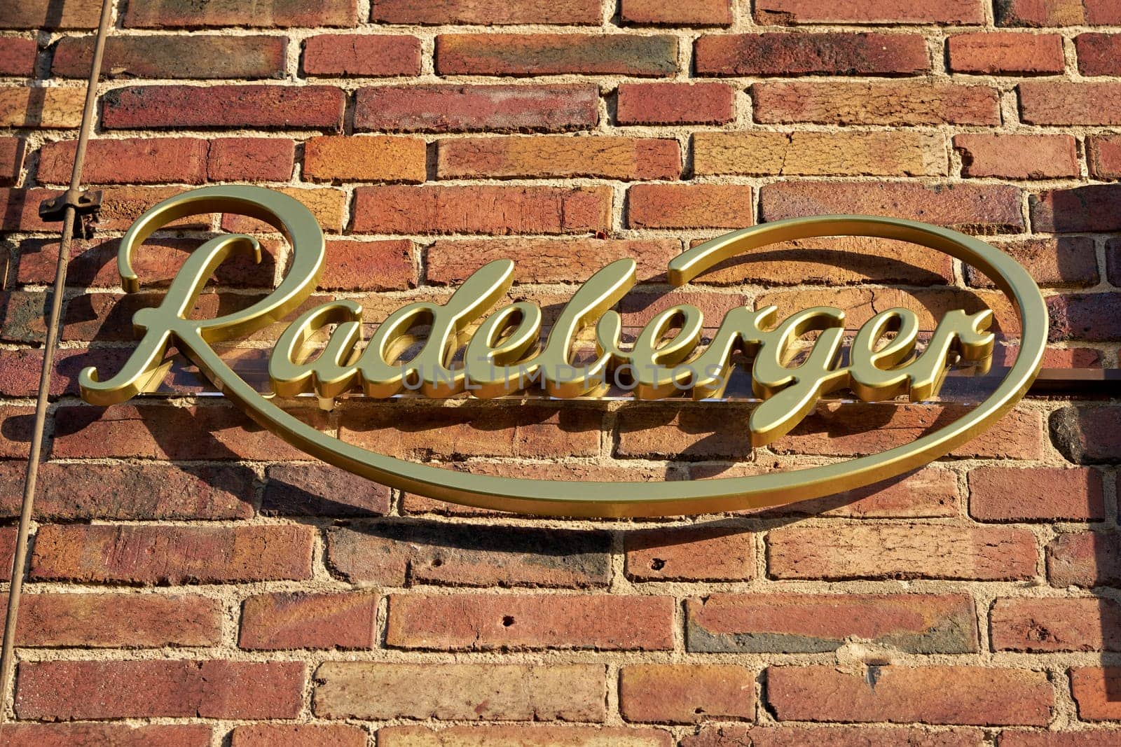 Lettering of the Radeberger beer brand on the facade of a restaurant in Germany