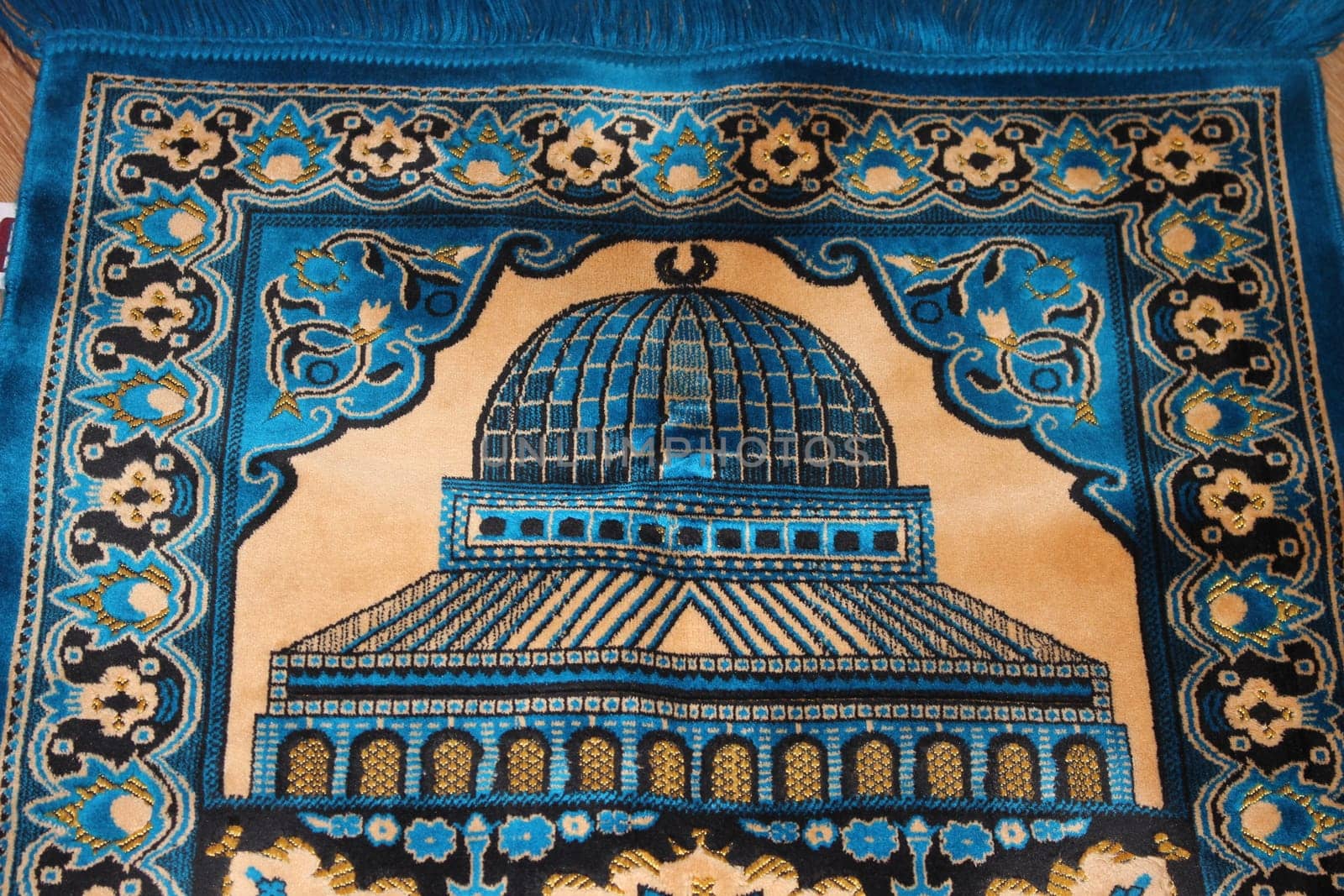 Closeup view of prayer rug in place to make prayer. High angle view of lovely prayer mat or prayer rug for Muslims