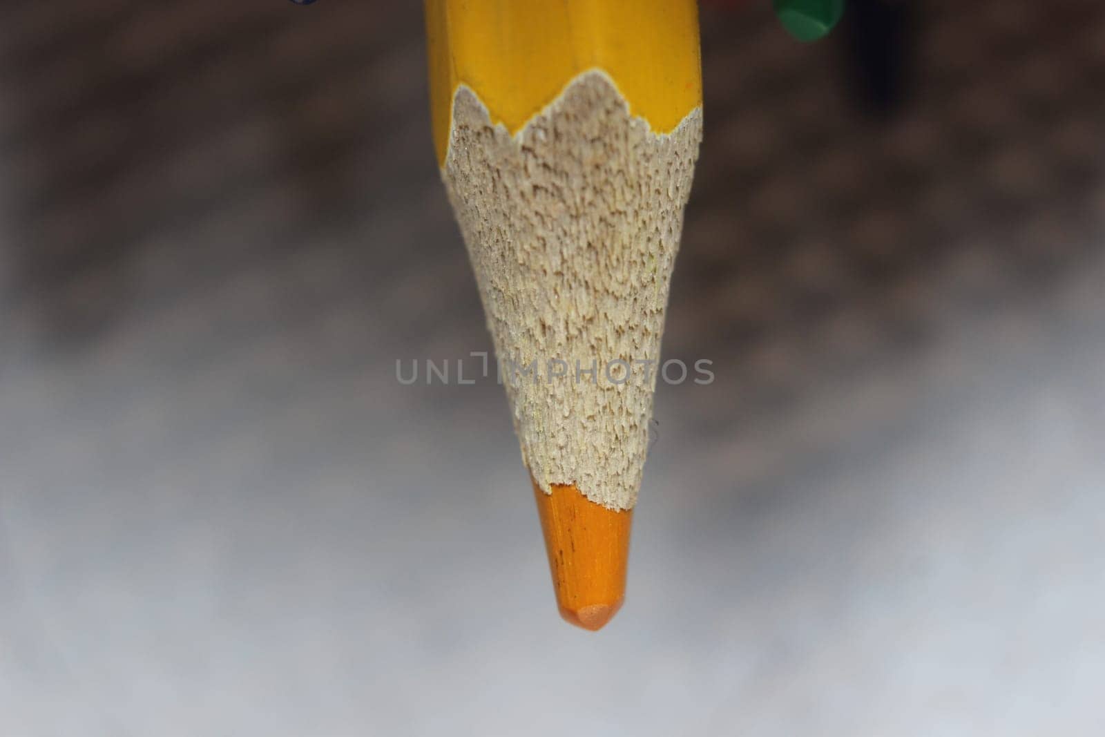 Close-up view of bright colored multicolor pencils on black background