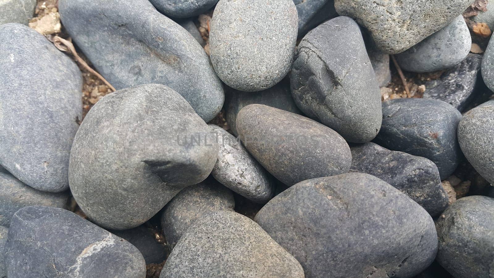 Rock Pebbles, small, rounded, smooth rocks. Texture background for text.