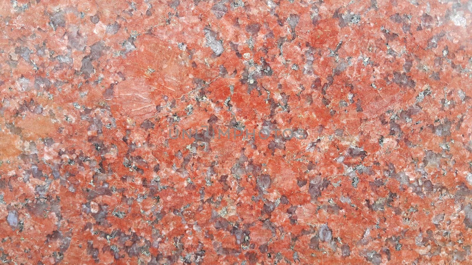 Reddish  floor abstract background:  Closeup texture of red concrete floor. A background of a red concrete or  wall in the sunshine.