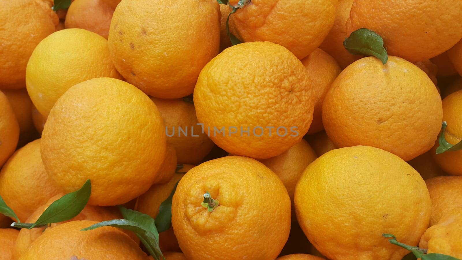Healthy, fresh organic oranges in supermarket for sale, pile of orange in market for texture