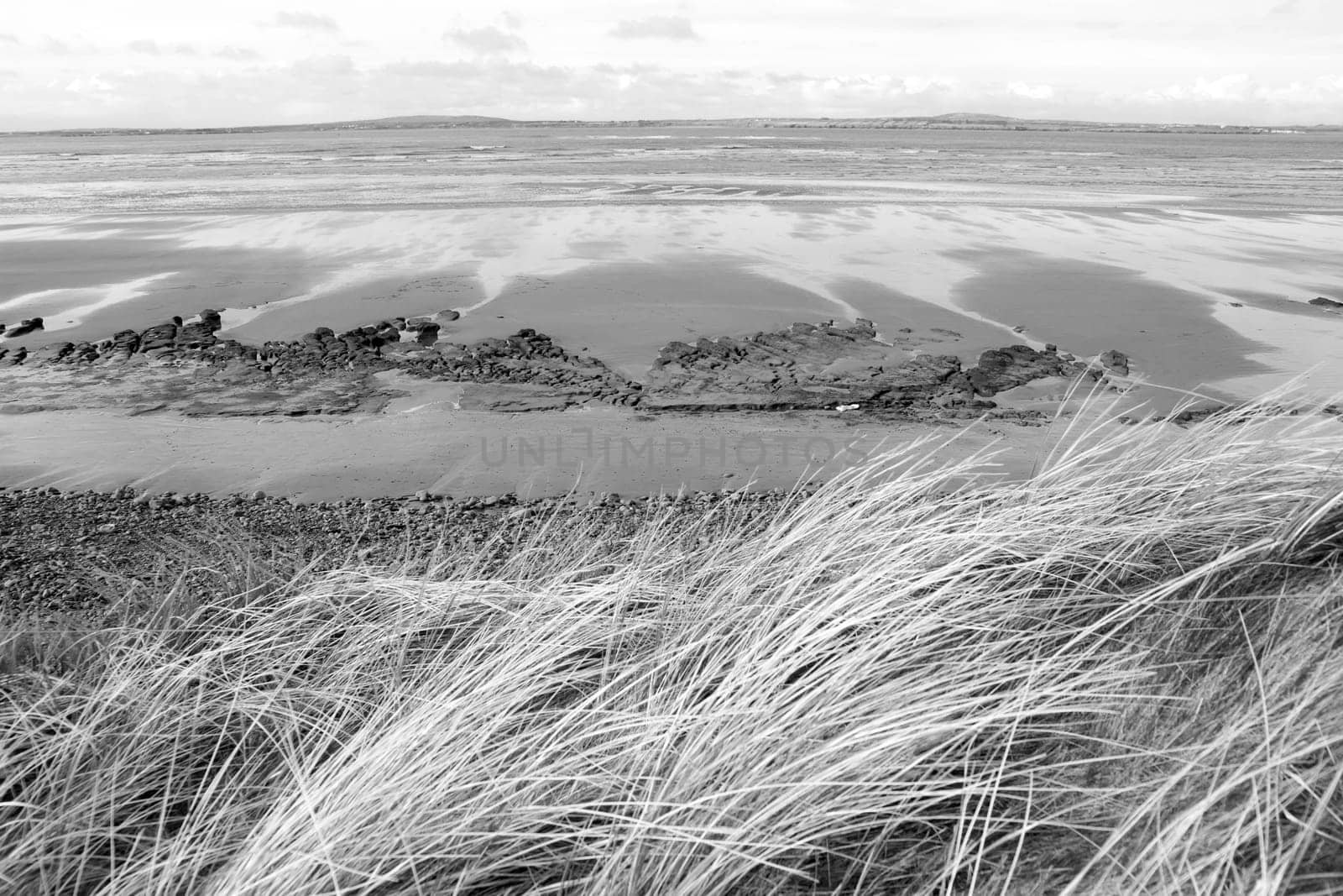 view of unusual looking mud banks in county Kerry Ireland from the sand dunes