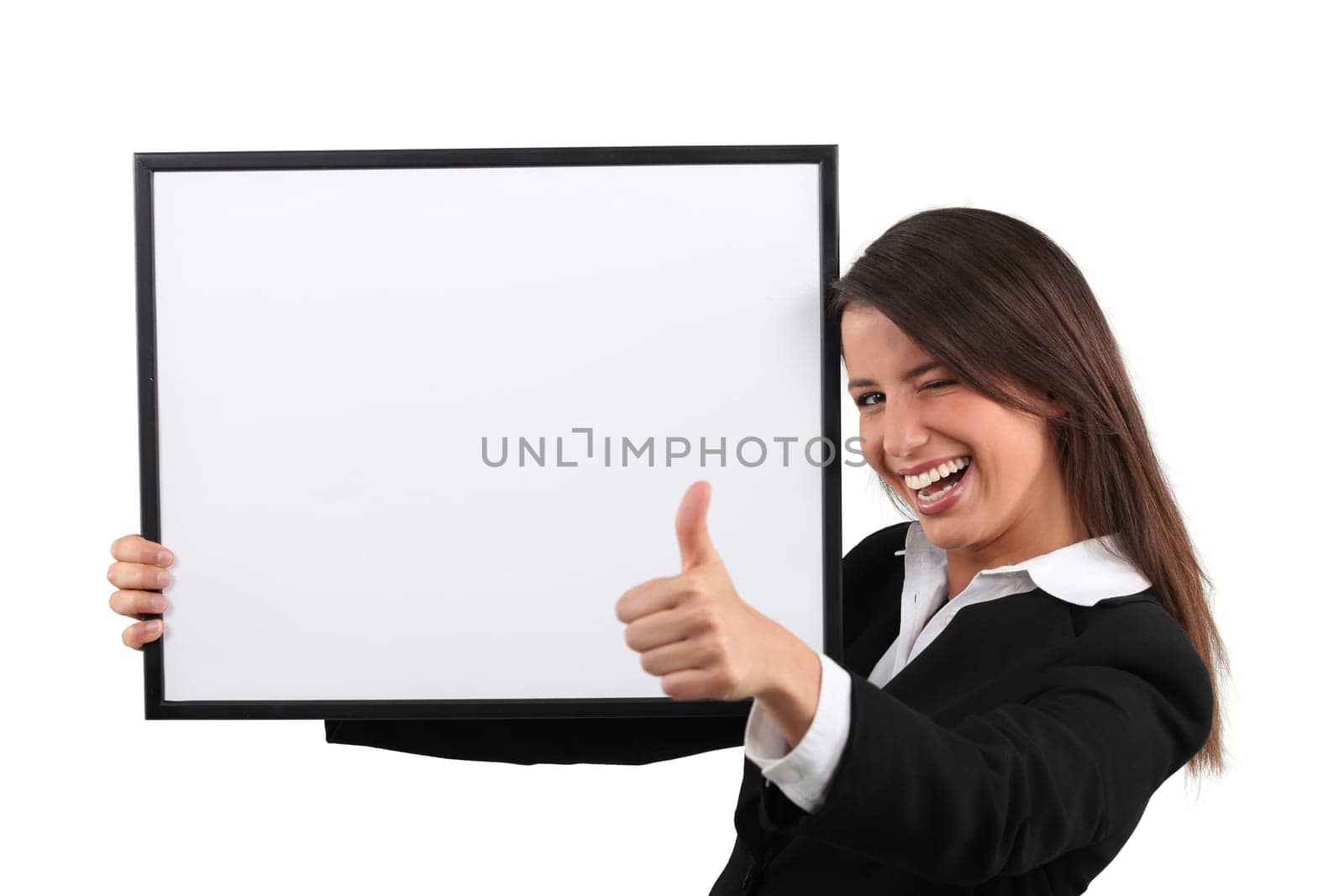 Enthusiastic woman giving the thumb's up and holding a whiteboard