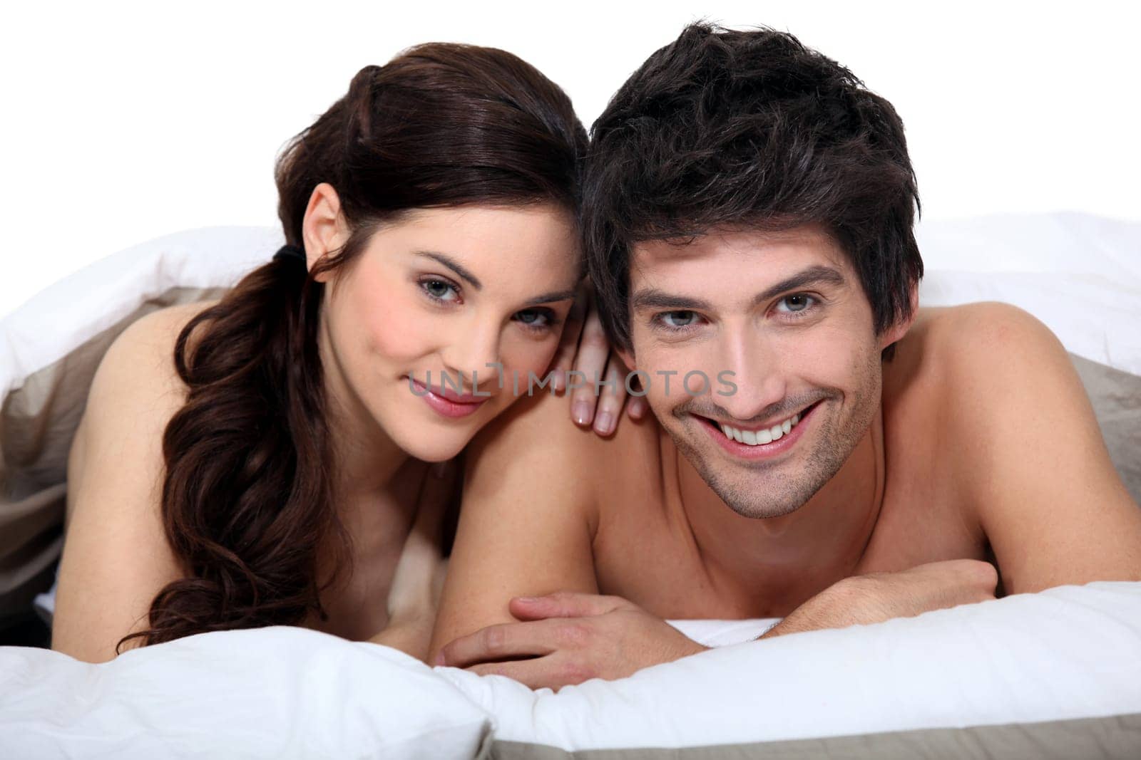 Portrait of a young couple in bed