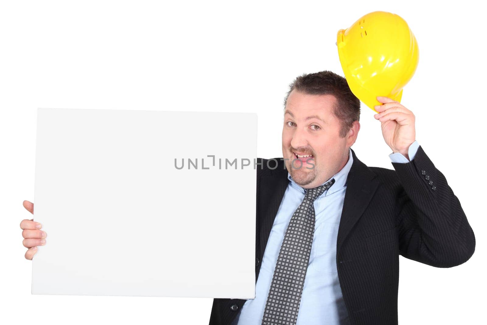 Businessman with hard hat and message board