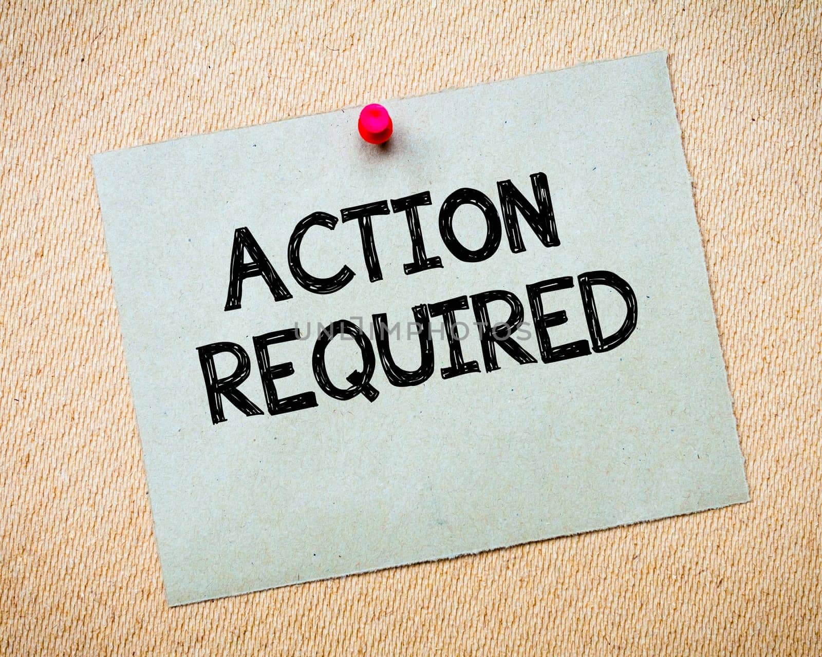 Recycled paper note pinned on cork board.Don' t Postpone Message. Motivational Concept Image
