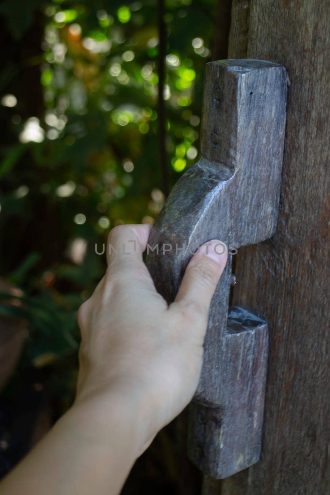 Hand on vintage wooden door, stock photo