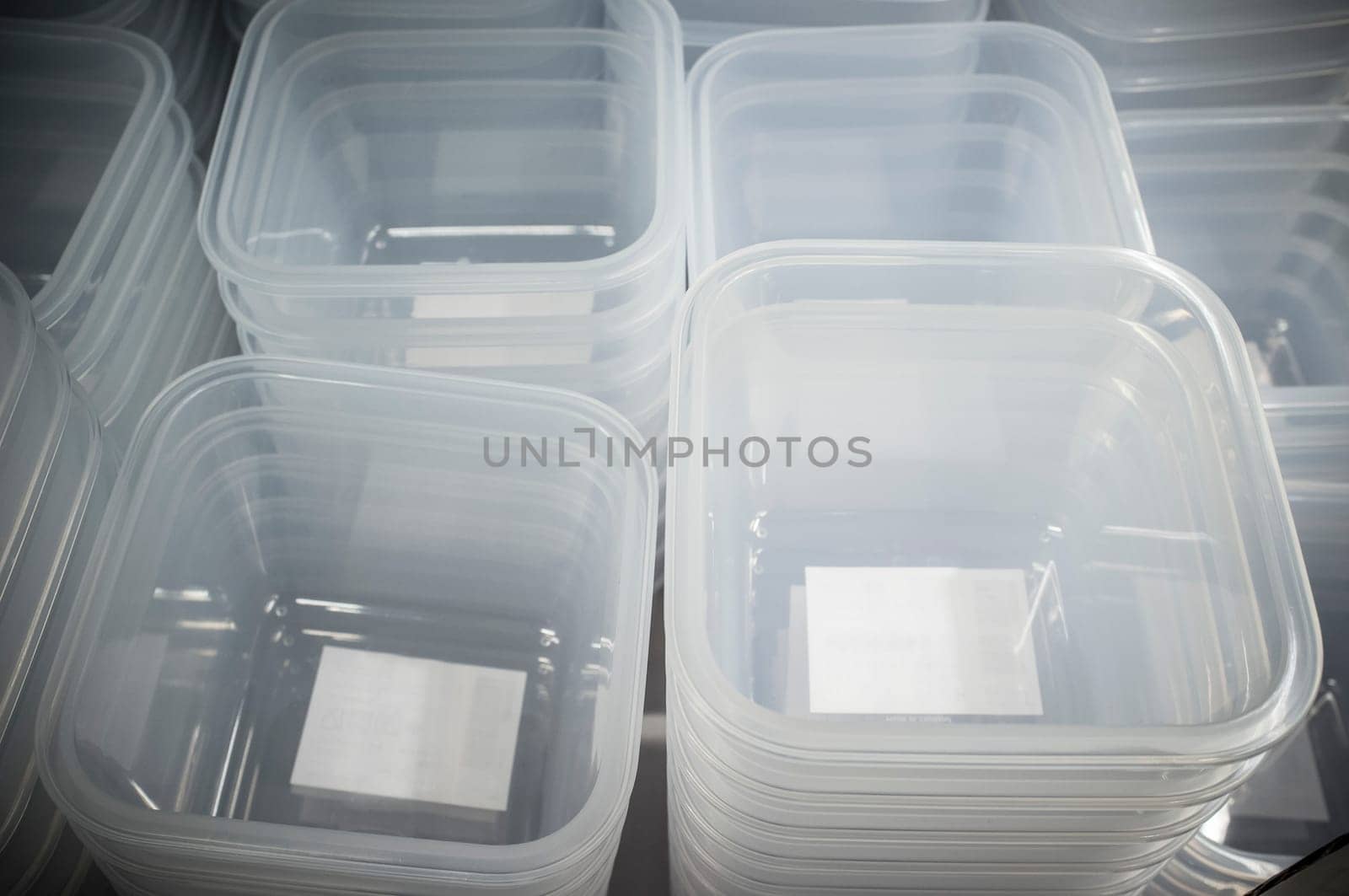 Piles of plastic food storage containers. Soft focus