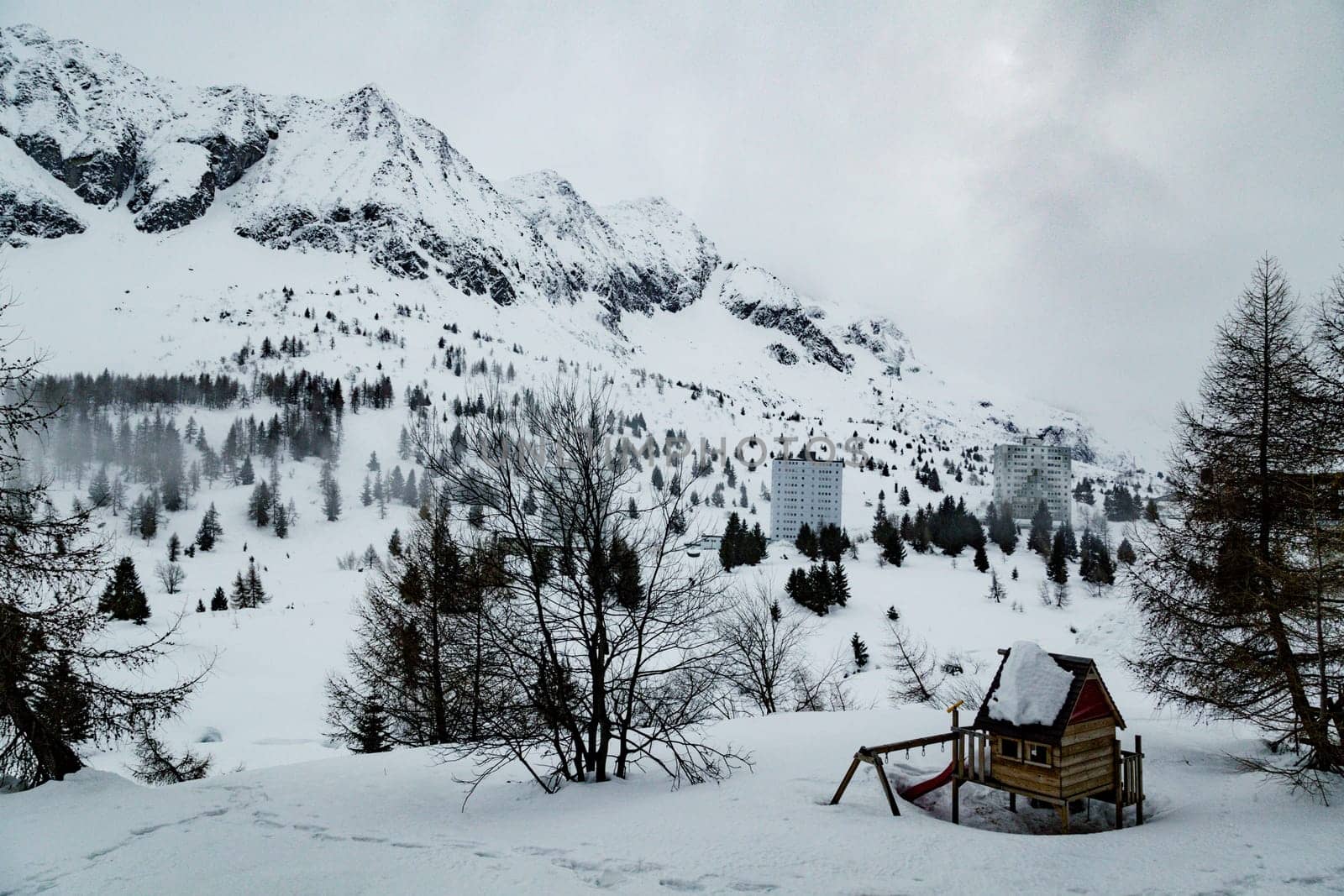 Winter landscape with lots of white snow. Concept of vacation during the winter holidays in the high mountains. Selective focus.