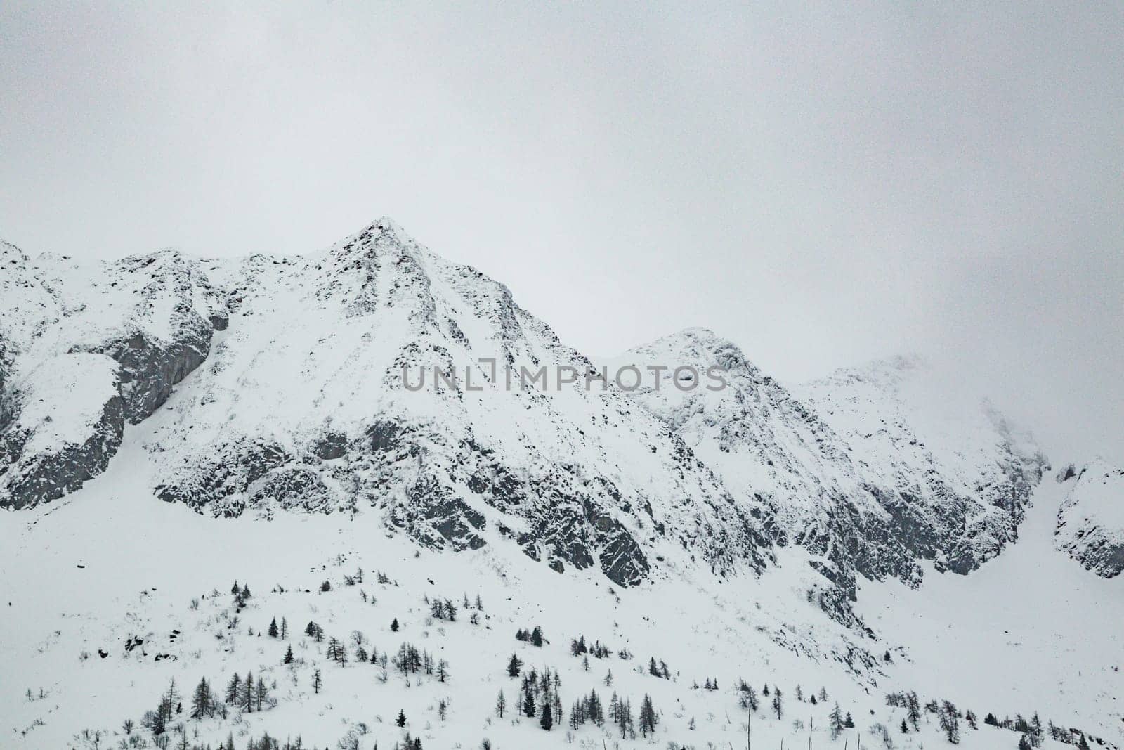 Winter landscape with lots of white snow. Concept of vacation during the winter holidays in the high mountains. Selective focus.