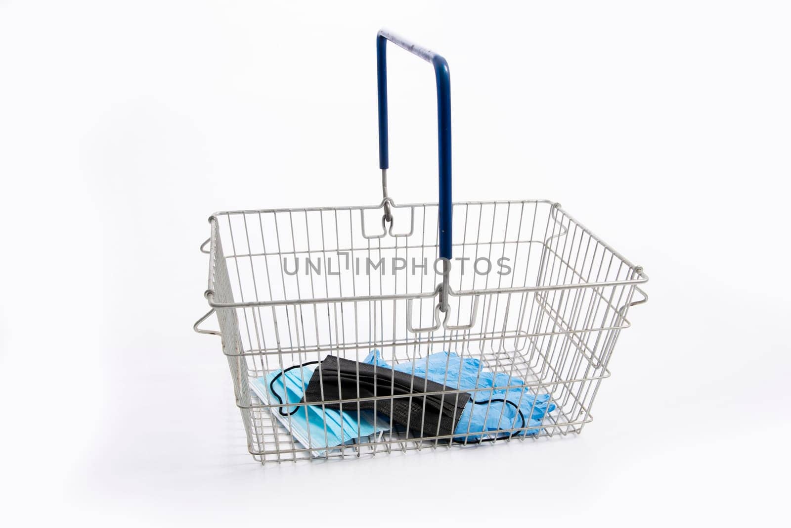Shopping basket with mouth protection and hand gloves, isolated on white background