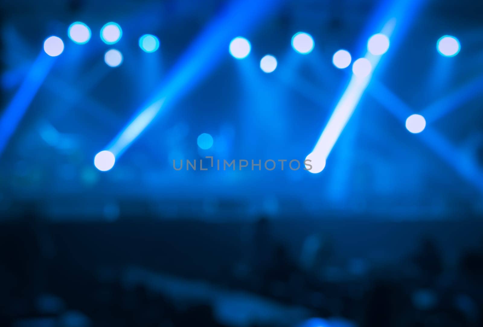 Blue stage lights with smoke. Spotlights of concert scene