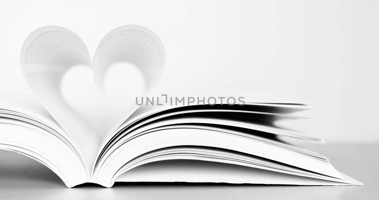 Pages of a book forming the shape of the heart.