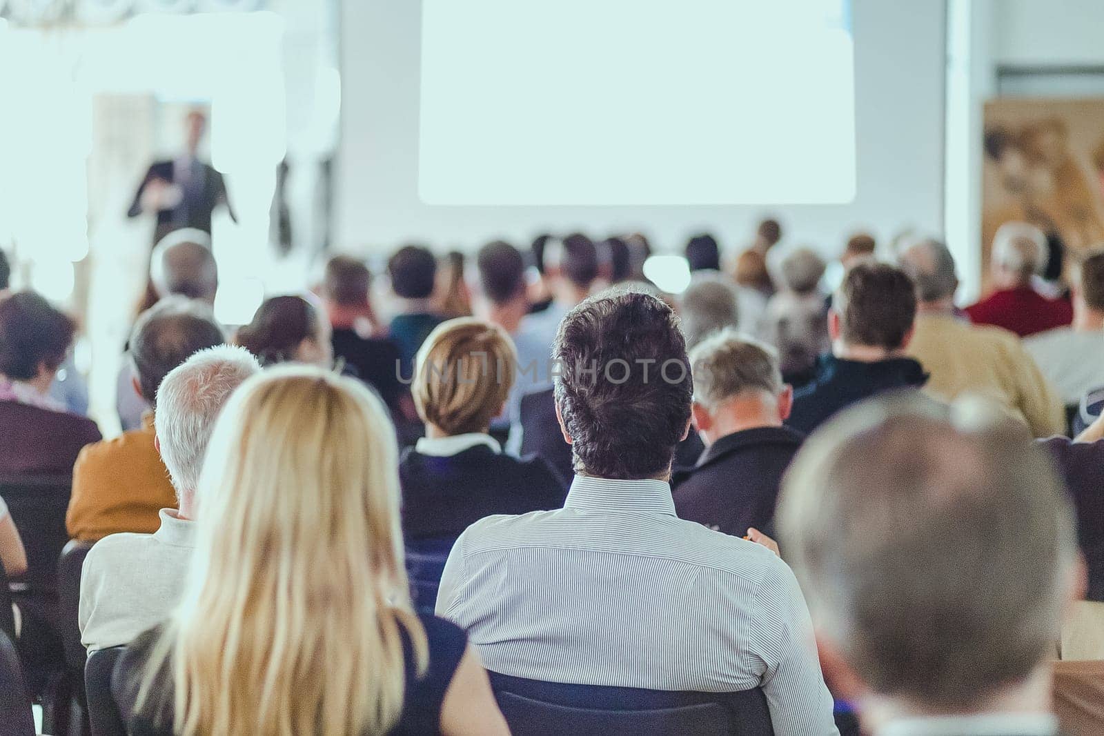 Speaker Giving a Talk at Business Meeting. Audience in the conference hall. Business and Entrepreneurship.