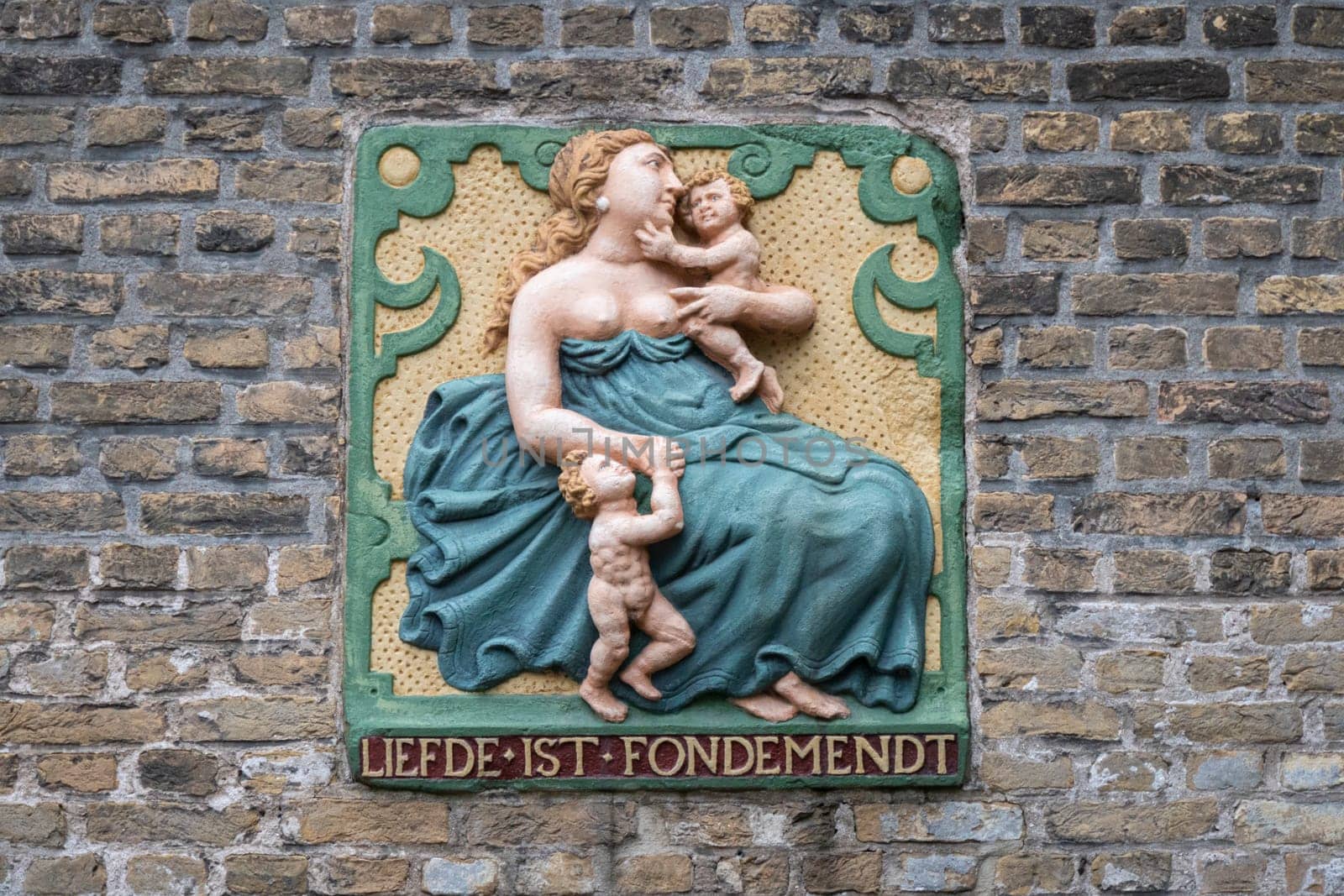 Traditional gable stone translated to Love is Fondness