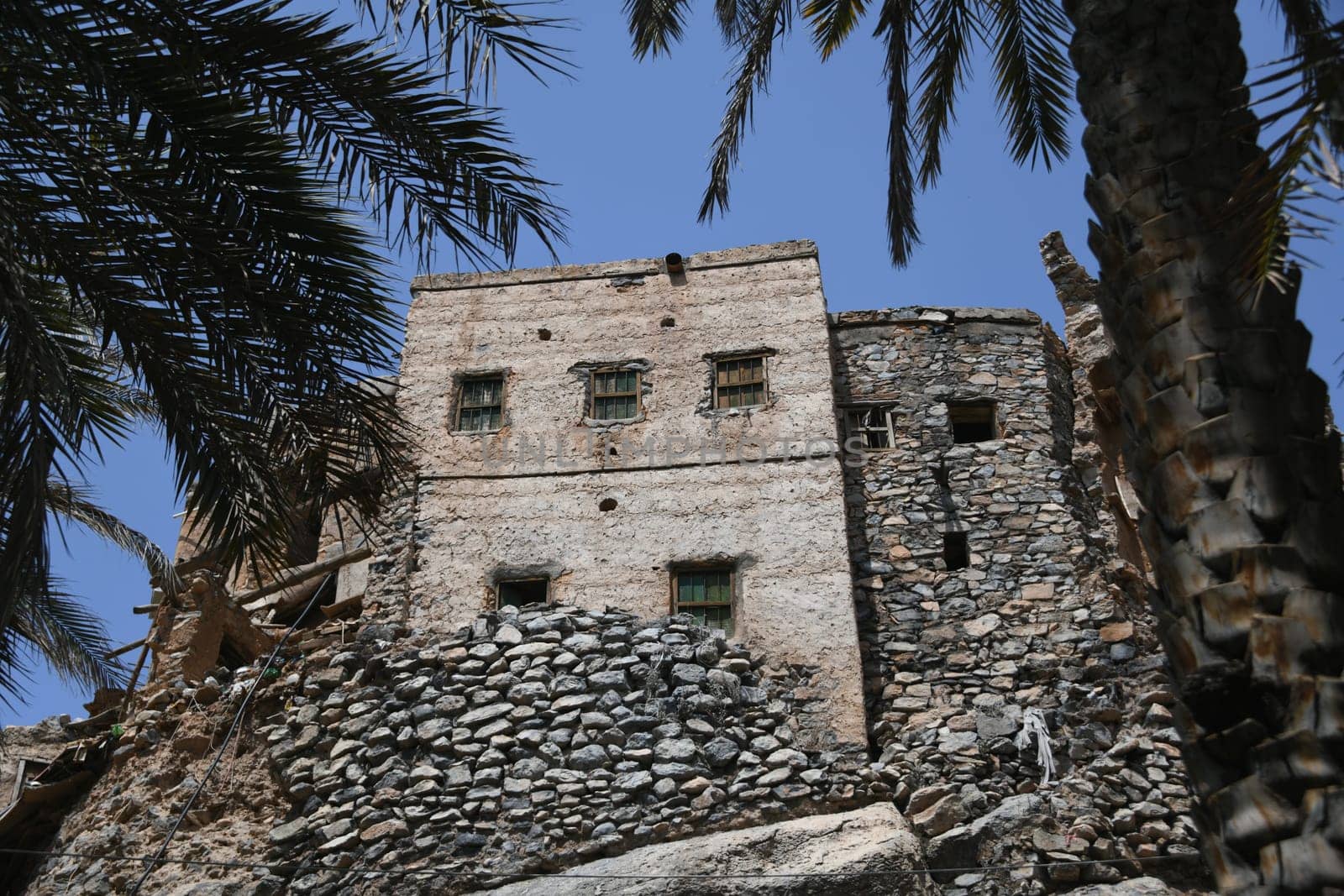 A house in the oasis of the mountain village Misfah in Oman where the famous Falaj irrigation system can be seen.