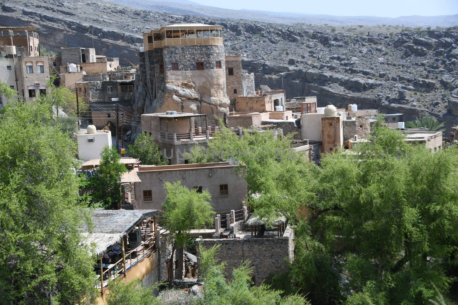 The panoramic view over the oasis of the mountain village Misfah in Oman where the famous Falaj irrigation system can be seen.