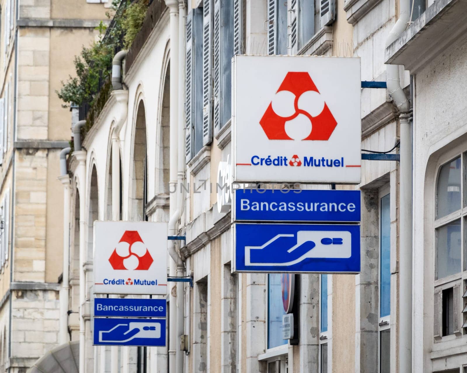 BAYONNE, FRANCE - CIRCA DECEMBER 2020: Credit Mutuel sign outside bank agency.