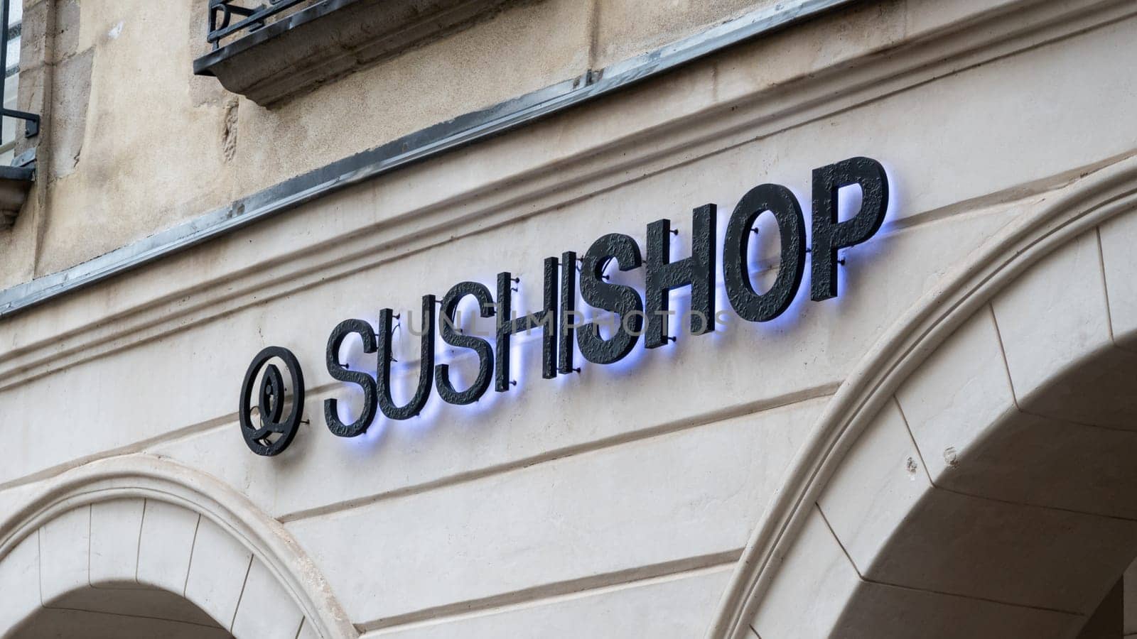 BAYONNE, FRANCE - CIRCA DECEMBER 2020: Sushi Shop sign. Sushi Shop is a French chain of Japanese fast food restaurants.