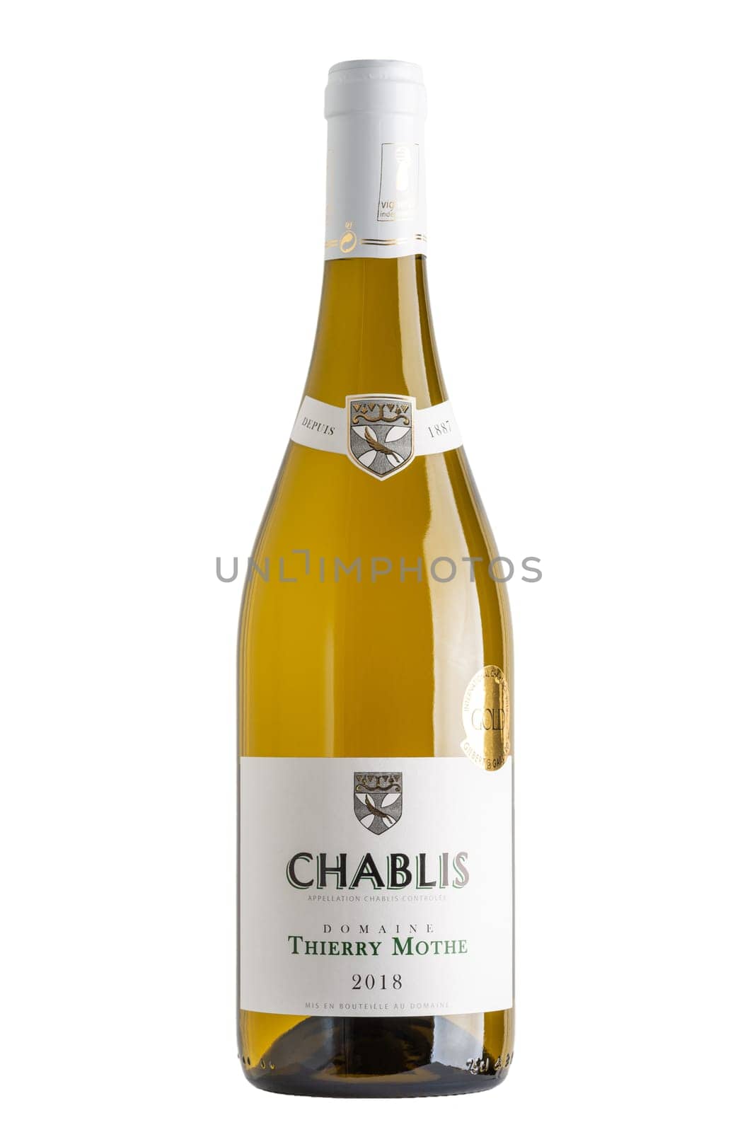 Bottle of white Chablis wine isolated on white, Thierry Mothe domain, vintage 2018. Gilbert et Gaillard International Challenge 2019 gold medal.