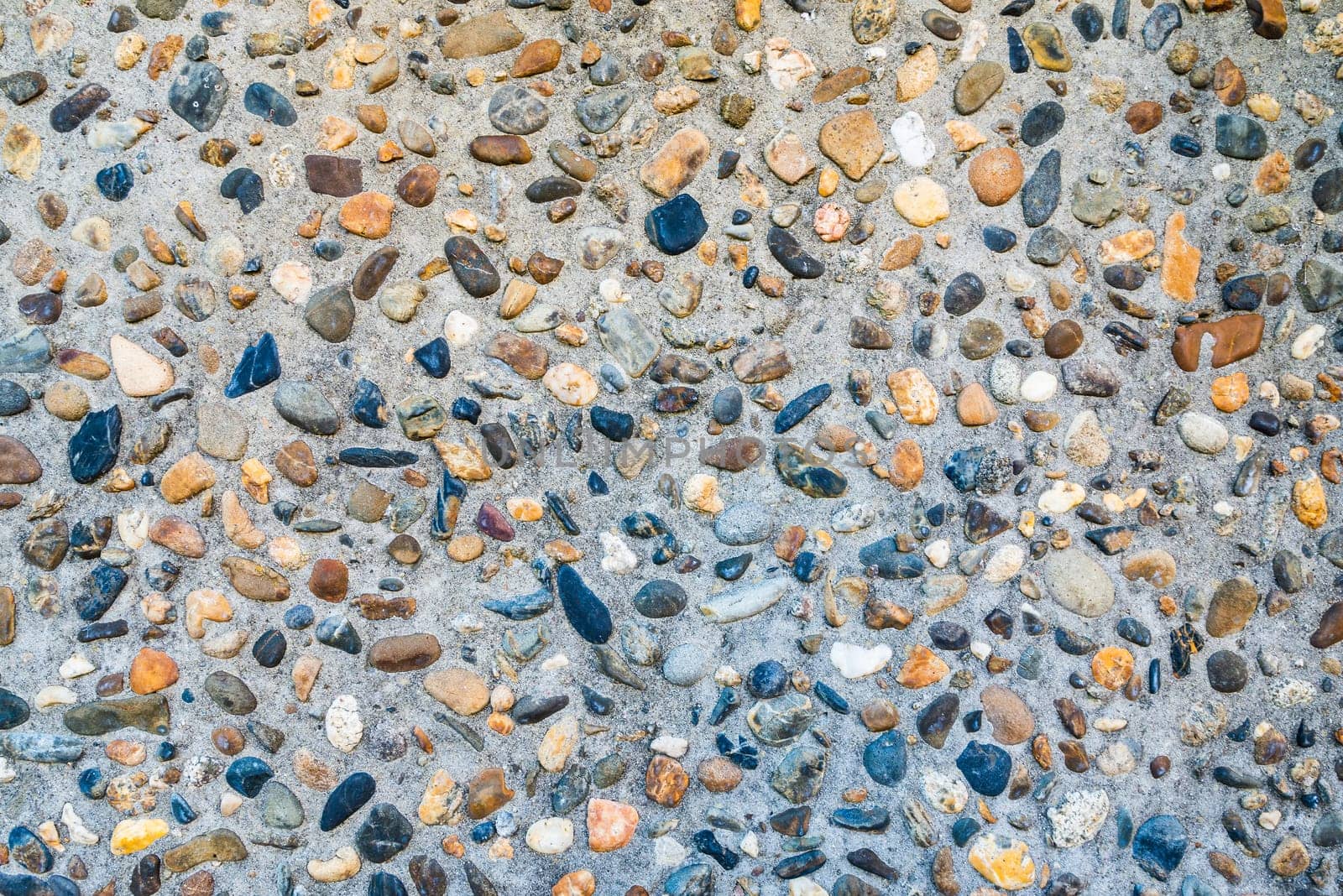 Small pebble and cement floor background texture