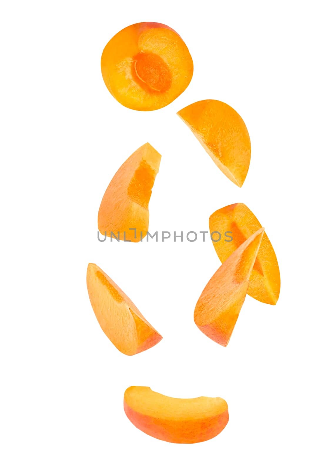 Flying fruit. Seven pieces of falling apricot fruits isolated on withe background with clipping path as package design element and advertising. Full depth of field.