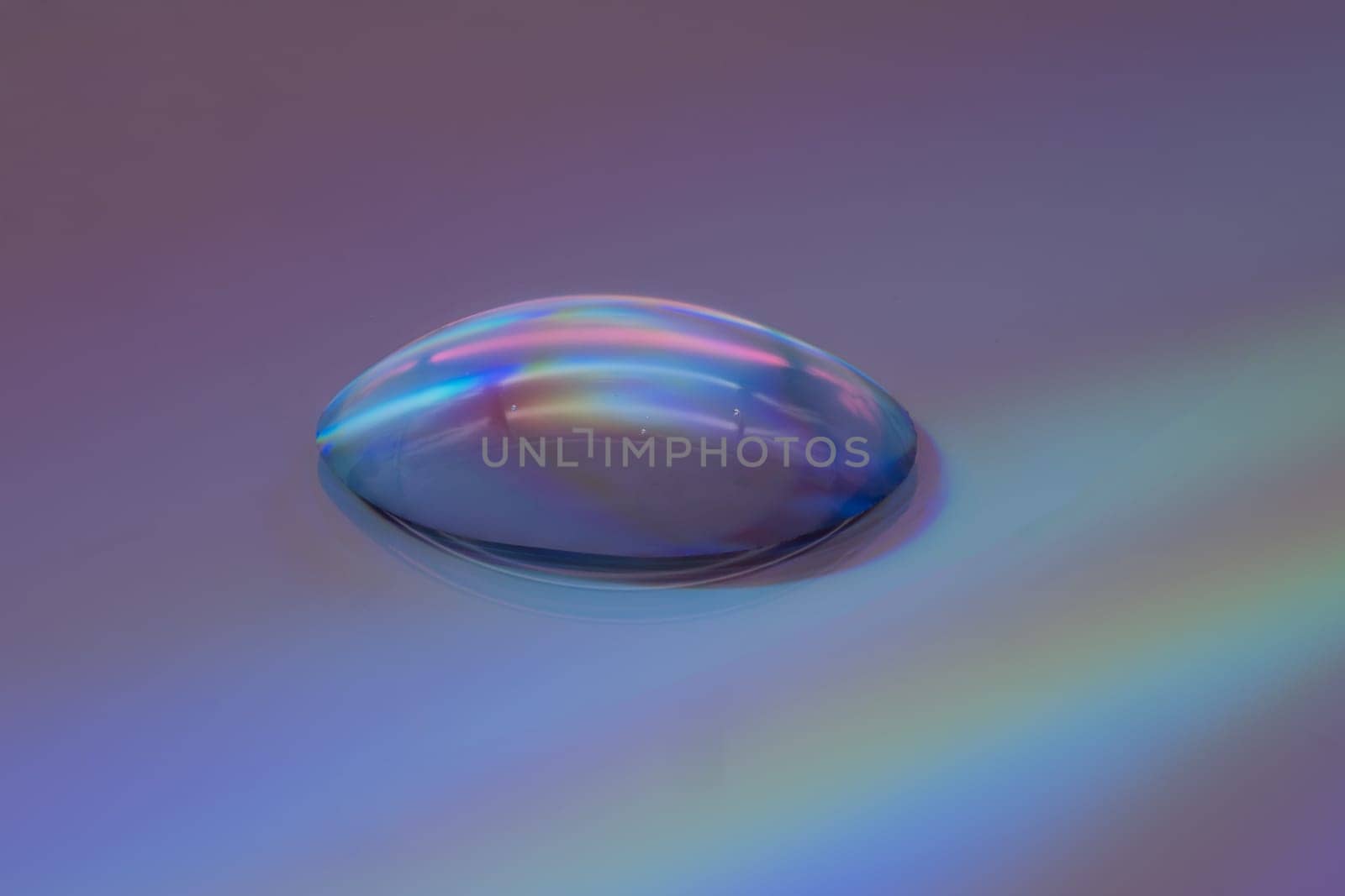 Drop Extreme Close Up, studio shot of water drop on dvd