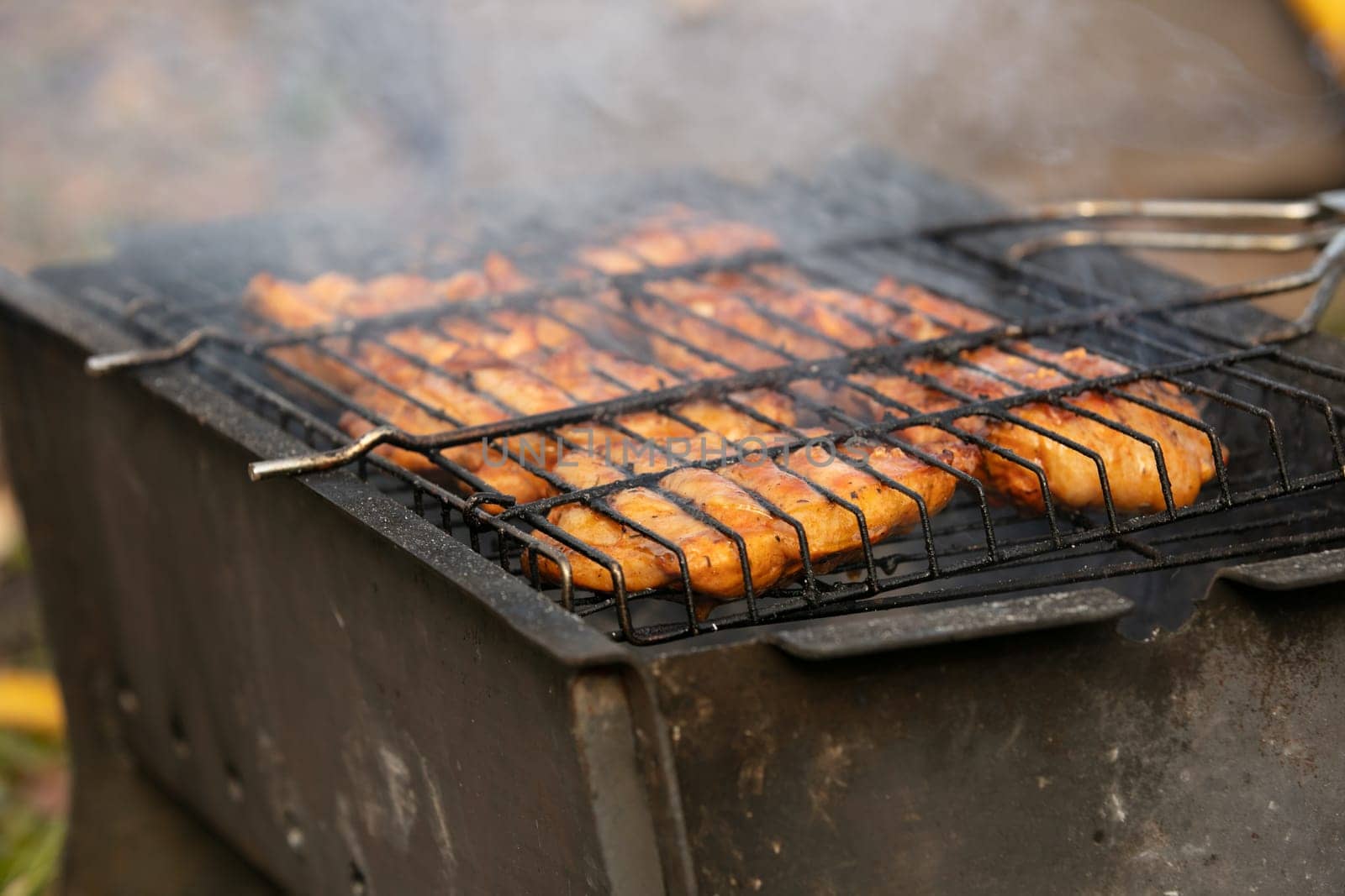 Delicious meat, grilled on a grill with a delicious crust cooked in the open air