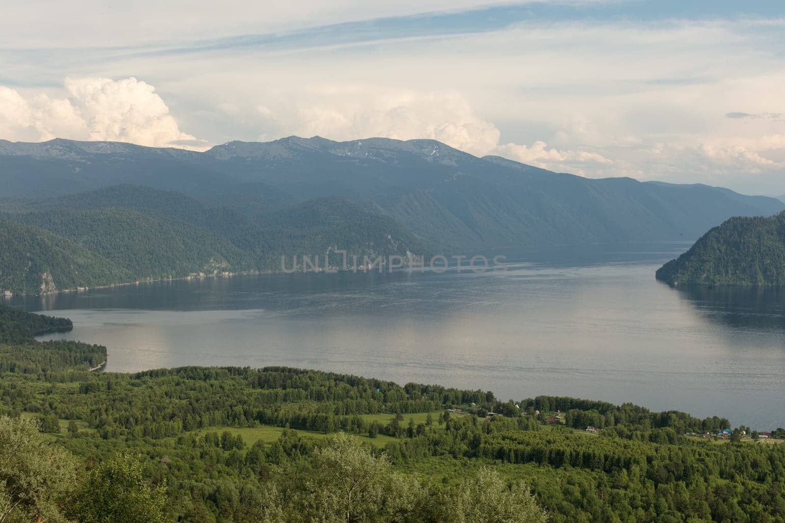 Lake Teletskoye with calm water on a summer day