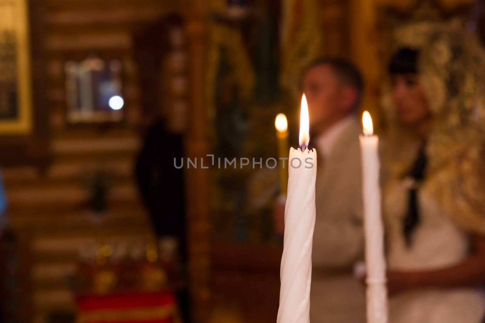 wedding in a Christian church, candles are burning. the sacrament.