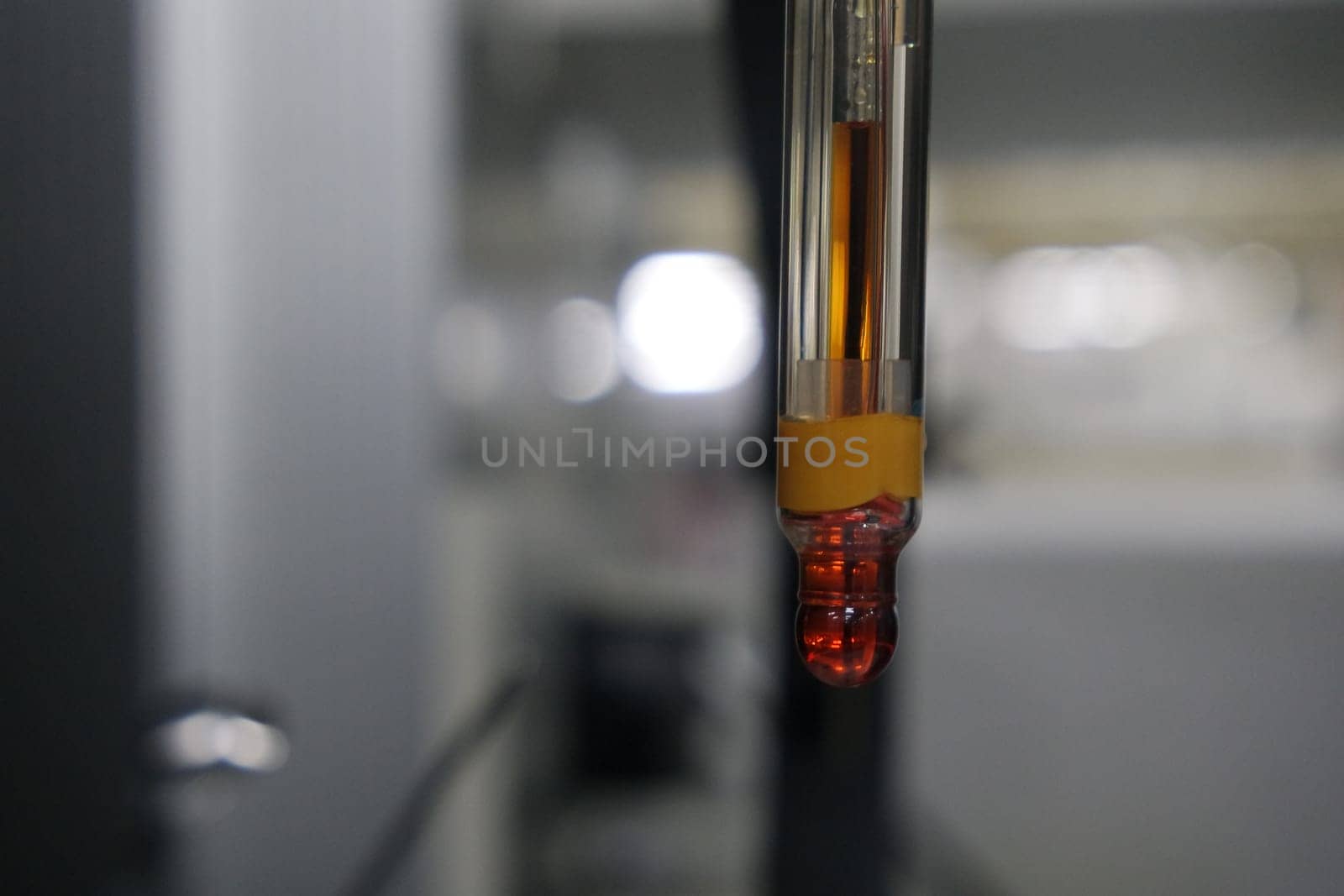 Close-up view of pH meter, a device for measuring pH with equipment for analysis of solutions quality in a chemical laboratory