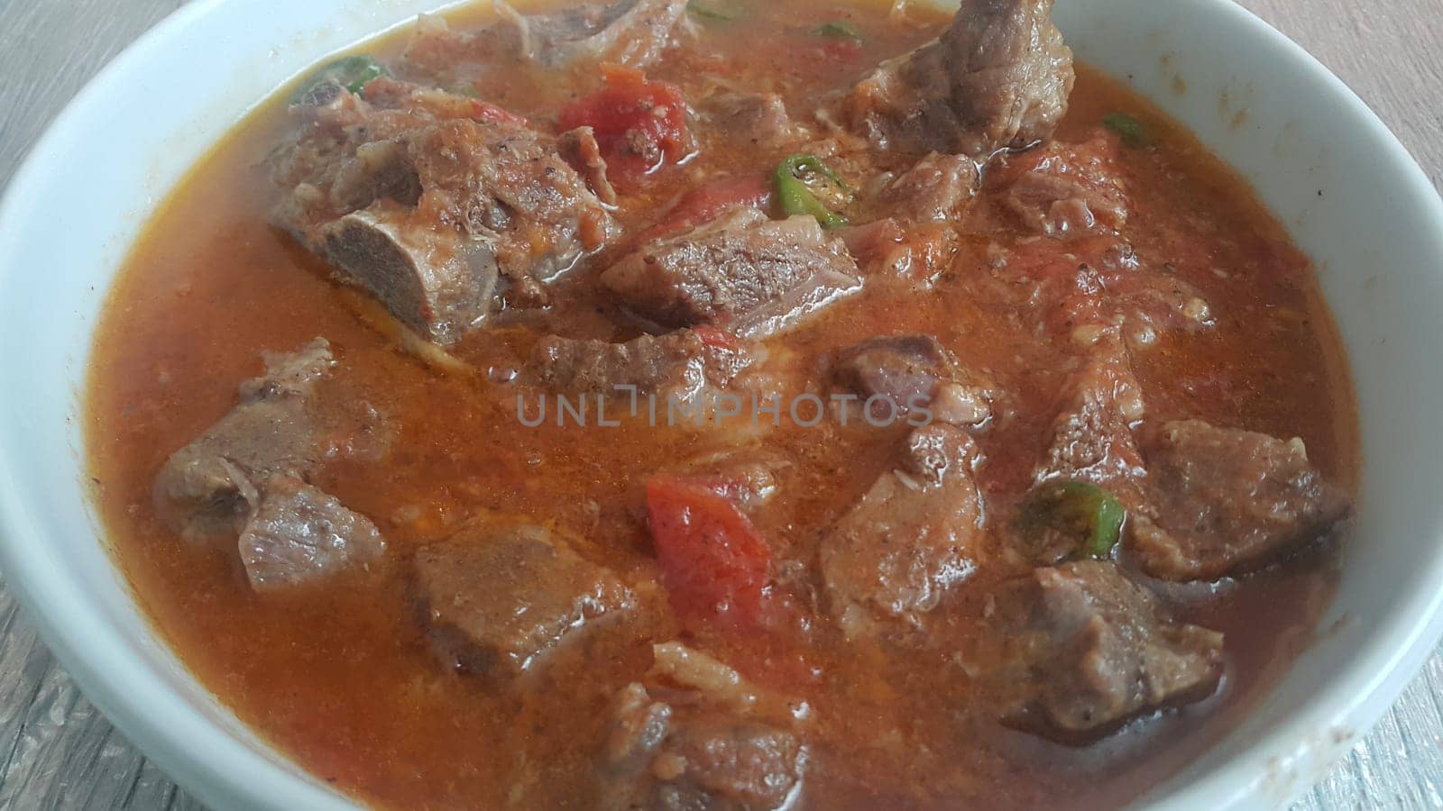A close up view of stewed chicken meat cubes with spices on it, a traditional home made delicious chicken meat dish