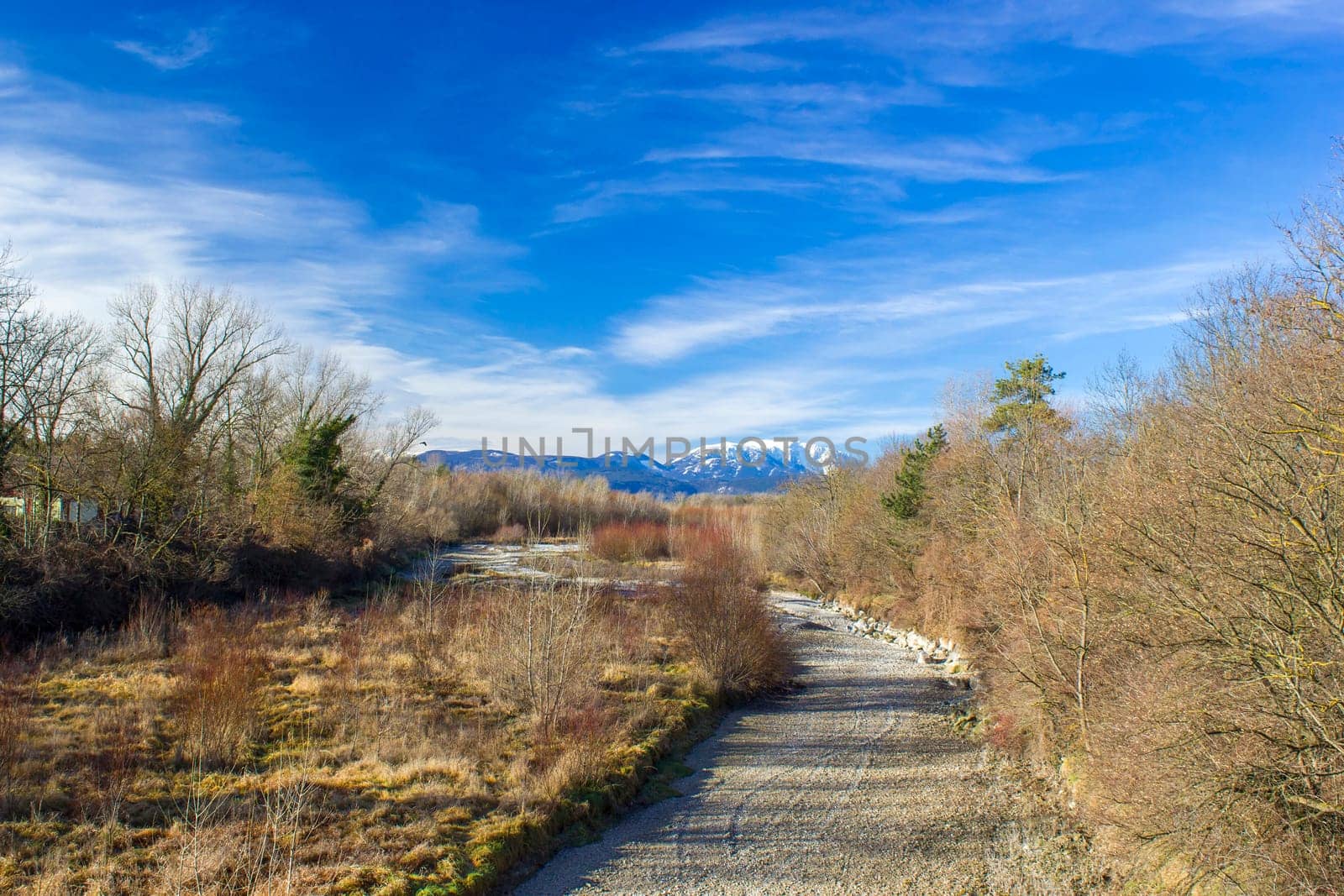 Dry river Schwarza in Bad Erlach and view of Rax Mountain in Lower Austria