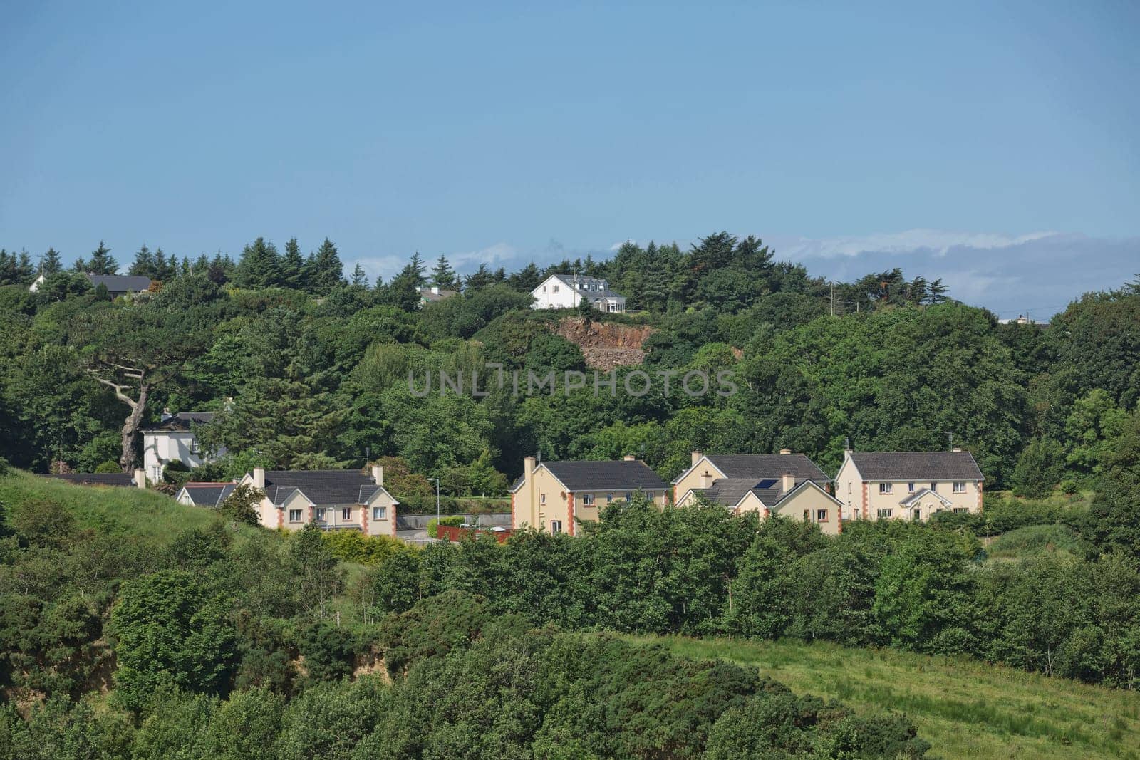 People enjoying living in beautiful landscape full of rock formations along the irish coastline near Killybegs, County Donegal in Ireland.
