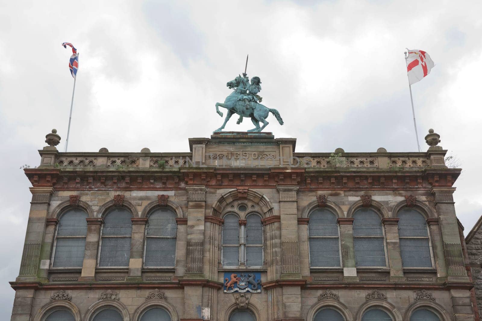 Belfast Orange Hall on Clifton Street with statue of king william on th.e top and stone facade in Belfast Northern Ireland.