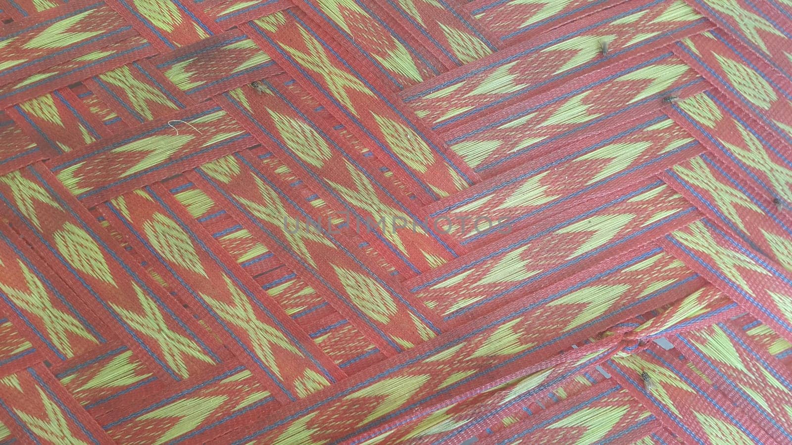 Colorful plastic woven stripes of traditional bed used in rural areas.