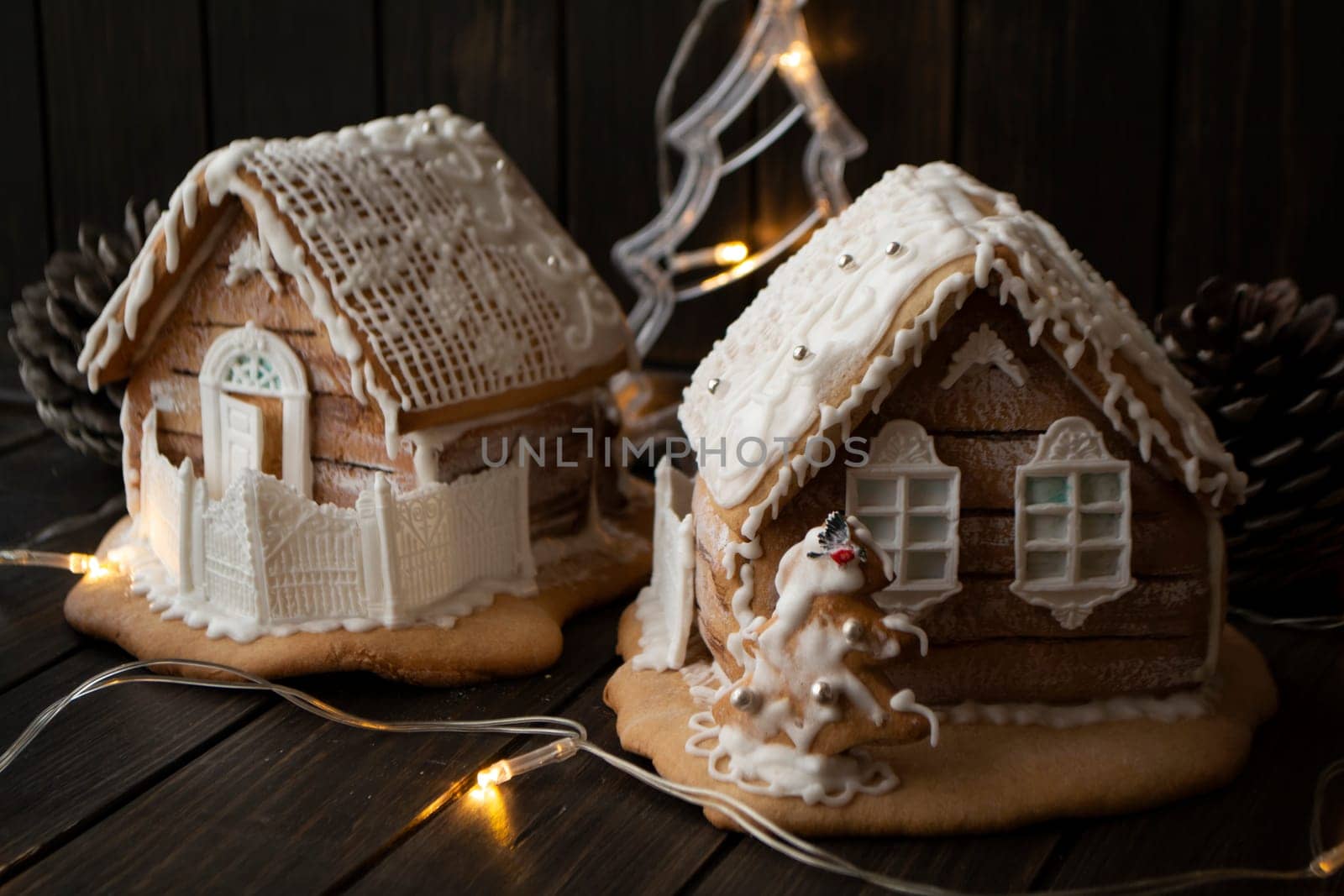 Homemade gingerbread houses in traditional belarussian style on dark background