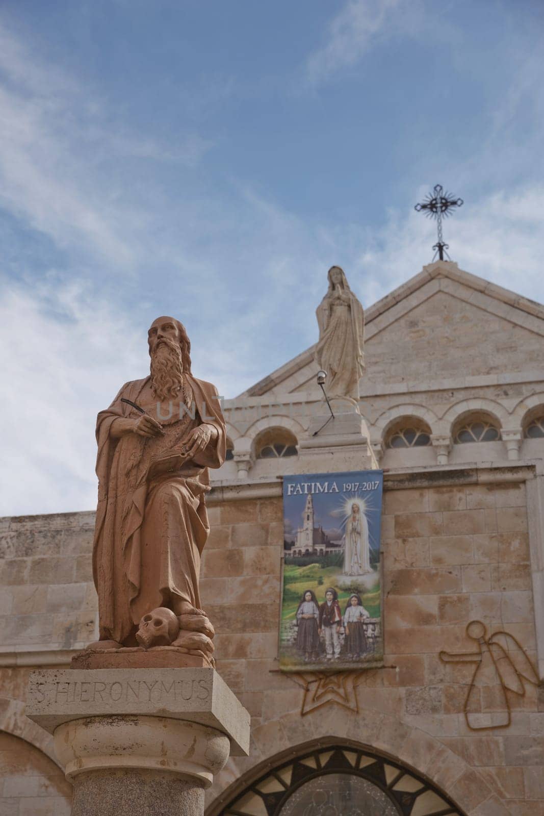 Bethlehem, Palestine, Israel - October 24, 2017: A statue of Saint Hieronymus outside The Church of the Nativity which is a basilica located in the West Bank of Bethlehem.